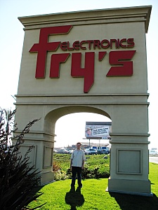 Shawn under the Fry's sign